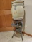 TEN GALLON PIX WATER COOLER WITH LID, SPIGOT, REFINSHED METAL STAND AND LEA