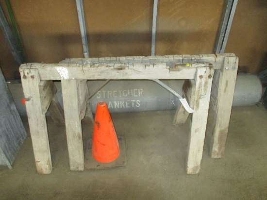 Pair of wood sawhorses and orange cone
