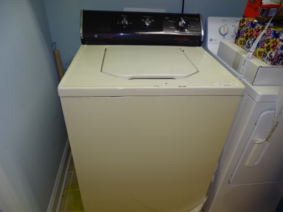 GE six cycle washing machine off white in color
