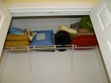 Shelf of decorative pillows