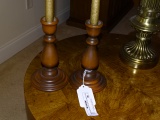 Pair of wood like candle holders with candles