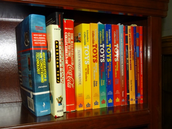 Shelf of Vintage Price Guides Coke & Toys