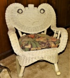 CHLID'S ORNATE WICKER ROCKER