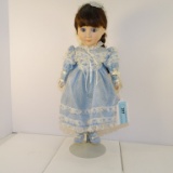 PORCELAIN DOLL IN A BEAUFUL BLUE DRESS