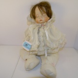 LARGE PORCELAIN DOLL DRESSED IN WHITE