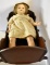 1930s COMPOSITION DOLL IN A CRADLE