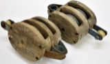 TWO PRIMITIVE WOODEN PULLEYS