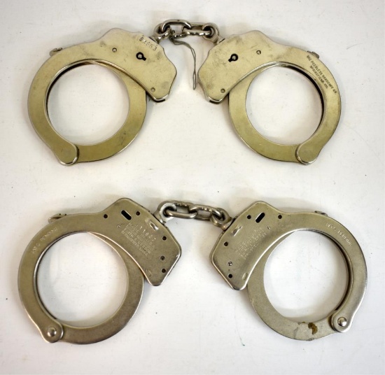 TWO PAIRS OF VINTAGE HANDCUFFS