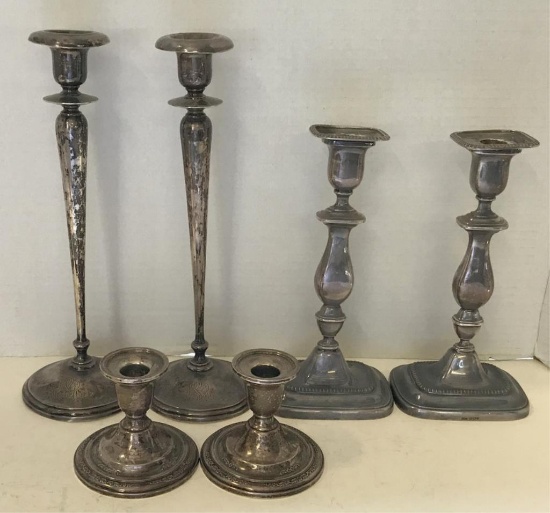 THREE PAIRS OF STERLING SILVER CANDLESTICKS
