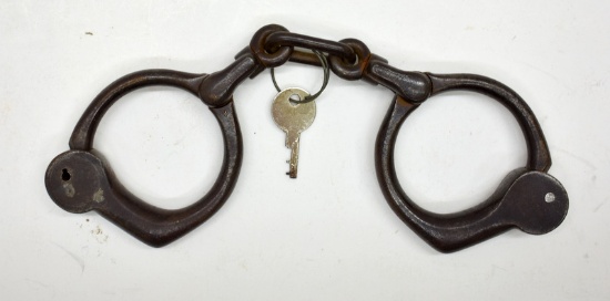 PAIR OF ANTIQUE IRON HANDCUFFS