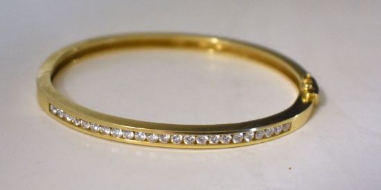 GOLD TONE BANGLE BRACELET WITH CLEAR STONE ACCENTS