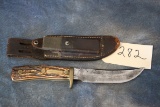 282. Uncle Henry Knife w/ Leather Sheath & Stone