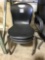 Black plastic stackable chairs