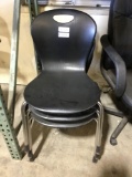 Black plastic stackable chairs