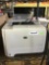 HP LaserJet P2055dn Printer and Silver Metal Trash Can