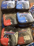 Assorted vehicle self tightening traction chains In bags
