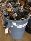 Large trash can with golf clubs