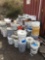 Assorted pails of paint and primer