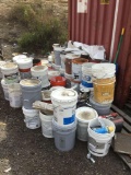 Assorted pails of paint and primer