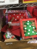 Assorted Christmas Items including wrapping paper, ornaments, and gift ribbons