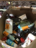 Assorted deodorants, lotions, bronzers, and shower items