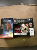 (2) Items (1) NFL Deluxe Helmet And Uniform Set (1) Ultra PRO Football Display