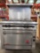 (1) Wolf. Range/Oven. Gas 115V. 4 burners. On wheels.