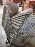 (12) Chairs. Cushioned. Stacked on a mobile rack.