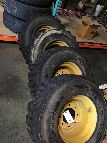 (4) CATERPILLAR Pneumatic Skid Steer Rims and Tires***LIKE NEW***