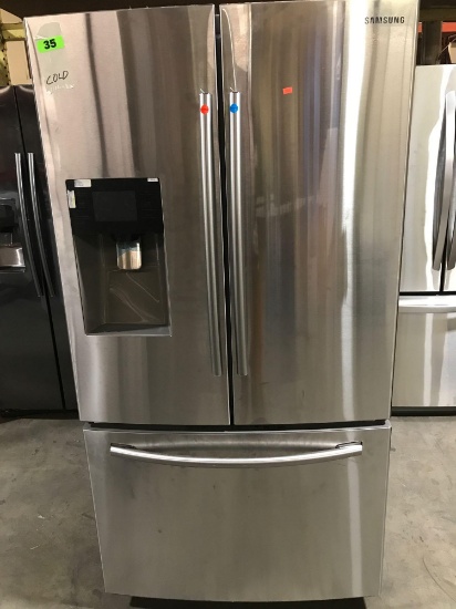 Samsung 24.6-cu ft French Door Refrigerator with Dual Ice Maker***GETS COLD***