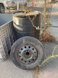 Lot of (1) Barrel of Degreaser and (1) Firestone Spare Tire