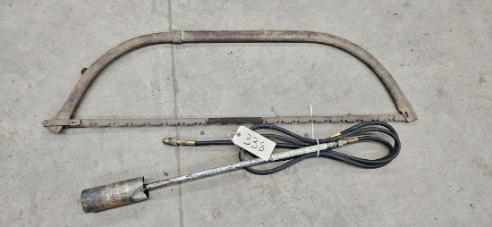 Weed torch and large bow saw