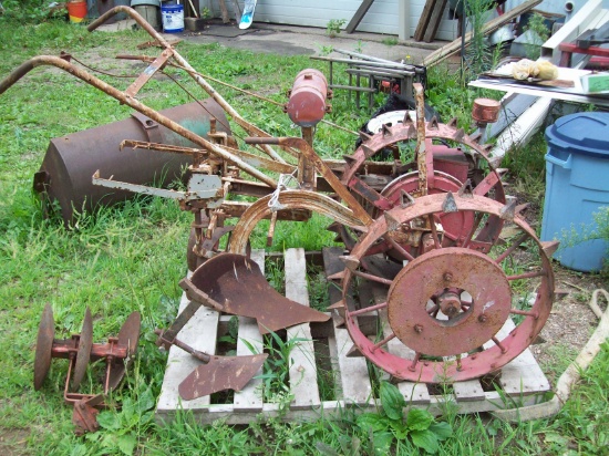 Kinkade garden tractor-steel wheels with lugs, single bottom plow and disc blade and other plow