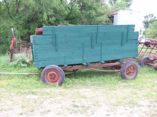 Model A Ford frame and wheels with wood farm box