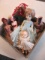 Assorted Dolls in basket con 636