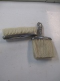Two Antique Sterling Brushes con 672