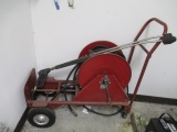 Pressure Washer Hose Cart and Hose and Wand should go with lot 561