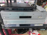 2 DVD and VCR Player and Remotes and DVD - will no t ship - con 555