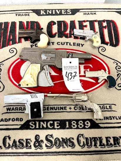 6 ASSORTED CAP GUNS AND LIGHTER