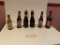 13 various beer bottle some full including one bowling pin style Budweiser bottle and 2 