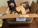 box of books and four videos