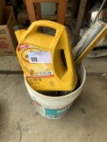 Bucket full 2 caulk guns, gallon of oil, yard sticks