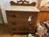 Walnut commode w/marble top and tear drop poles