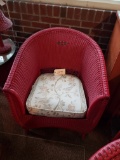 Red wicker straight chair originally from Junior home Tiffin Ohio