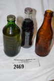 3 glass bottles -1- CocaCola- Amber  Cinni., Ohio, 1- 7 up - w/fluid 10 oz  in boss glass, 1- CocaCo