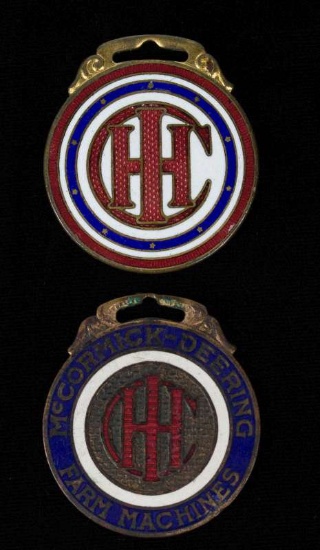 TWO INTERNATIONAL HARVESTER CO ENAMELED WATCH FOBS