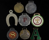 EIGHT VARIOUS ANTIQUE ADVERTISING WATCH FOBS