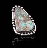 A MIKE PLATERO NAVAJO RING WITH ROYSTON TURQUOISE
