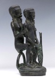 AN AFRICAN BRONZE FIGURE GROUP