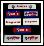 A COLLECTION OF FRAMED SKELLY GAS PUMP PLATES